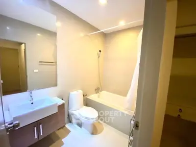 Modern bathroom with bathtub and sleek fixtures in a bright apartment