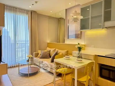 Chic modern living room with cozy seating and dining area, featuring floor-to-ceiling windows and stylish decor.