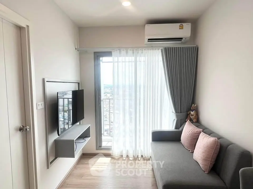 Modern living room with sleek design, featuring a wall-mounted TV, cozy sofa, and large window with city view.
