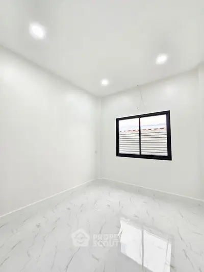 Bright empty room with modern white tiles and large window