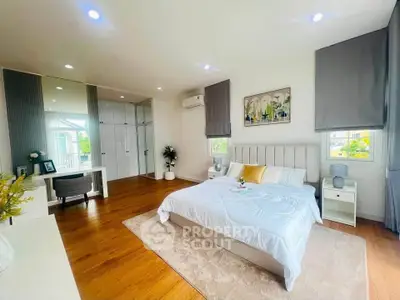 Spacious and elegant bedroom with modern decor and ample natural light