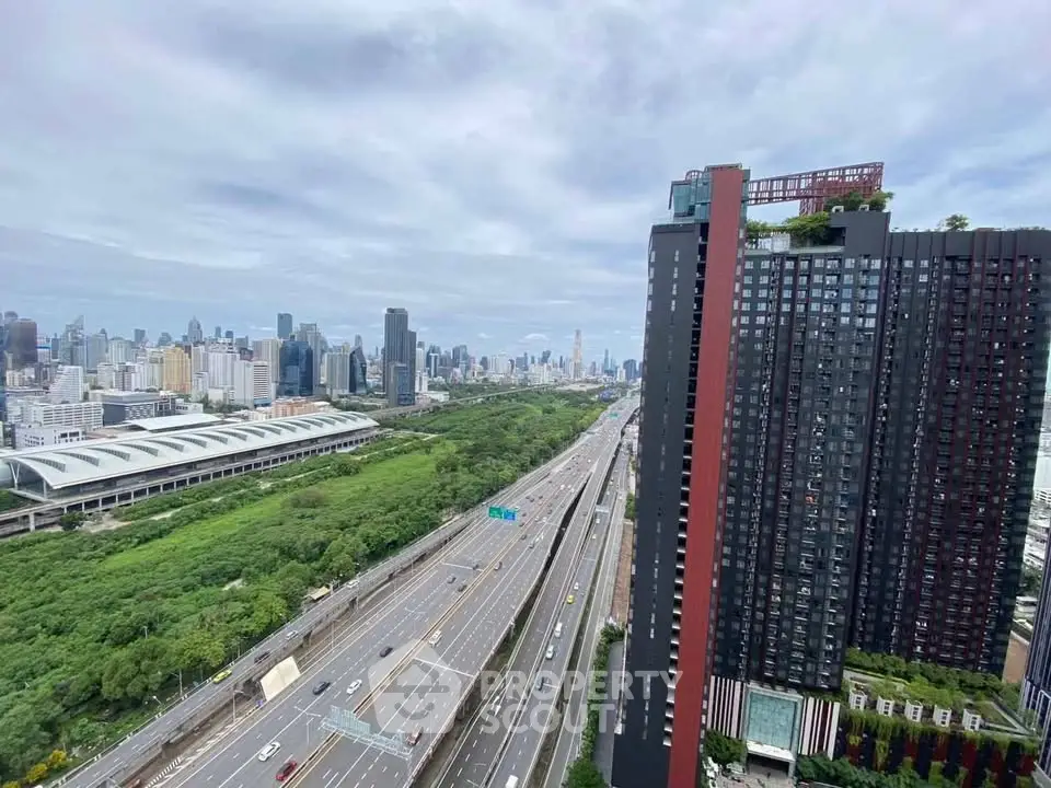 Stunning high-rise building with panoramic city and highway views, perfect for urban living.