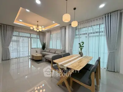 Spacious modern living room with elegant dining area and stylish lighting