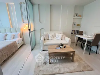 Modern studio apartment with cozy living area and elegant decor