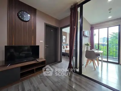 Modern apartment interior with stylish living room and dining area, featuring large windows and elegant decor.