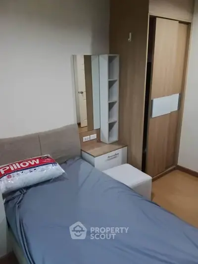 Cozy bedroom with modern furniture and stylish decor, perfect for a comfortable living experience.