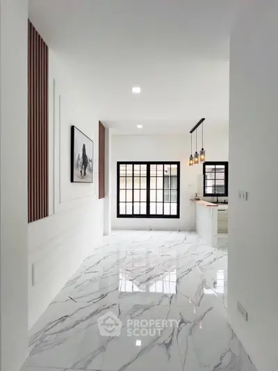 Modern interior with marble flooring and stylish lighting in open layout