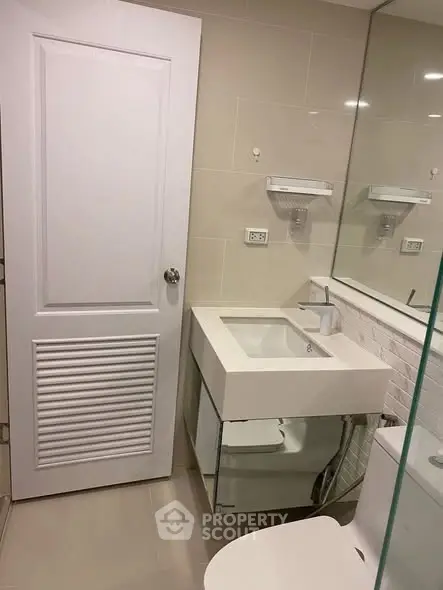 Modern bathroom with sleek sink and mirror design