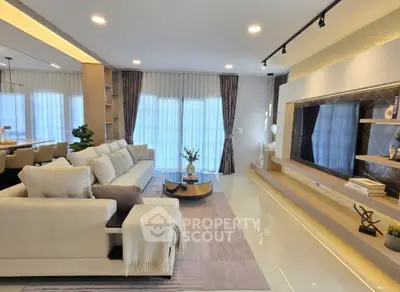 Luxurious modern living room with elegant decor and ample natural light