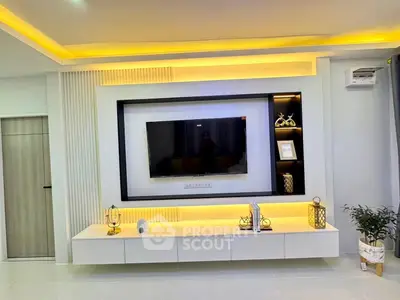 Modern living room with stylish TV wall unit and ambient lighting