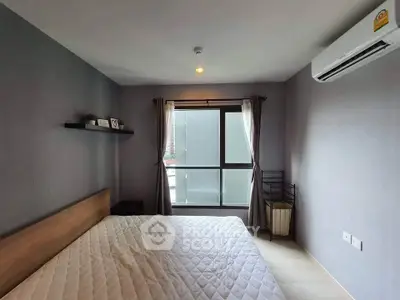 Cozy bedroom with modern decor and large window for natural light