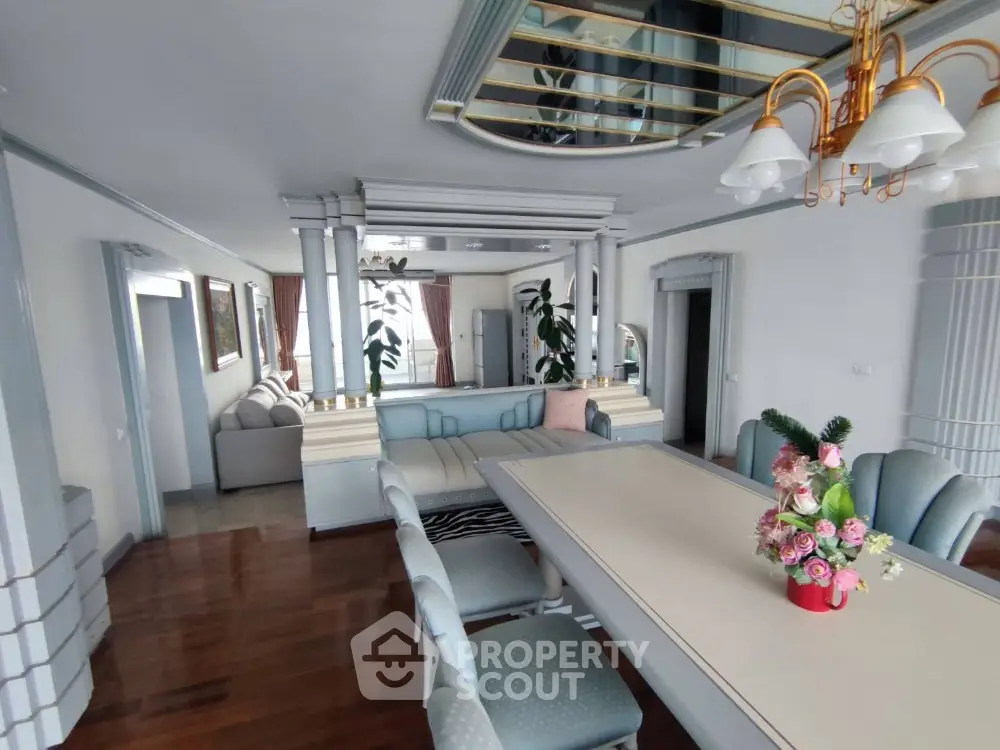 Luxurious dining room with elegant decor and mirrored ceiling in a modern home