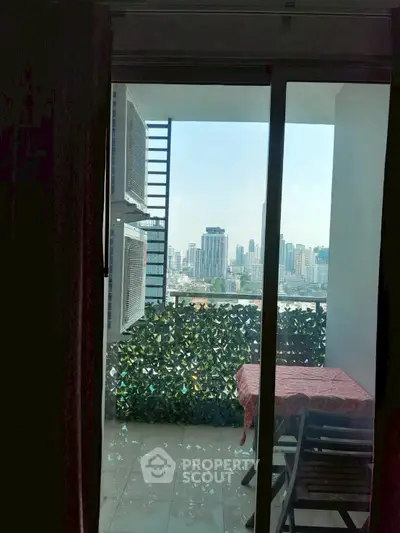 Charming balcony with city skyline view, perfect for relaxation and enjoying urban living.