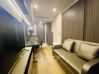 Modern living room with sleek furniture and ambient lighting in a stylish apartment.