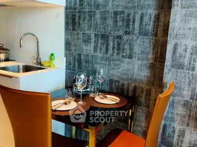 Modern kitchen with sleek dining area and stylish decor