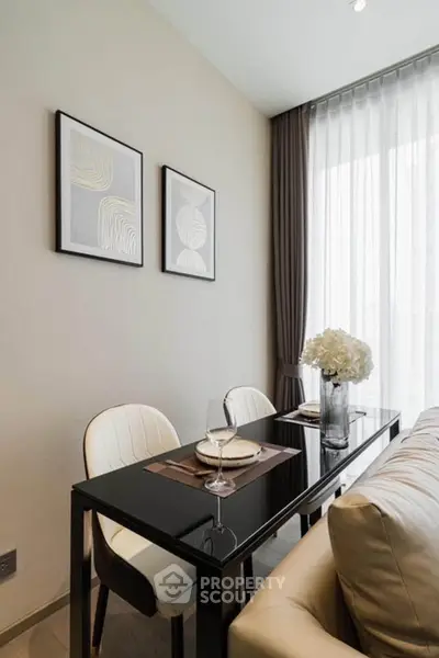 Elegant dining area with modern decor and natural light, perfect for intimate gatherings.