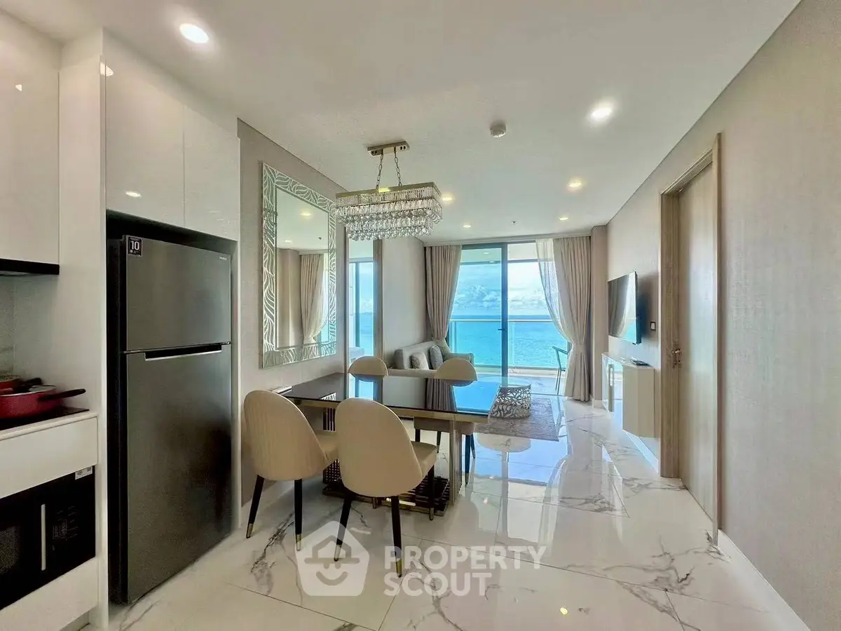 Luxurious open-plan living room with stunning ocean view and modern decor