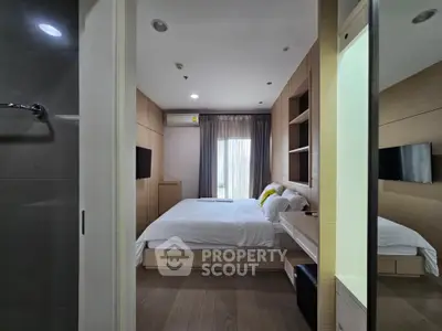 Modern bedroom with wooden accents and natural light, featuring a cozy bed and built-in storage.