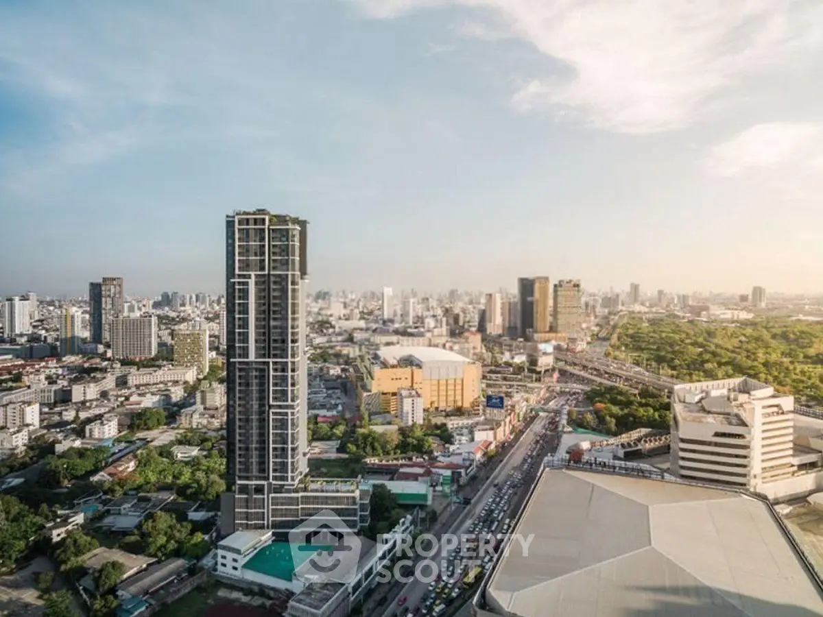Stunning cityscape view showcasing modern high-rise buildings and lush greenery, perfect for urban living.