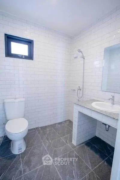 Modern bathroom with sleek white tiles and elegant fixtures