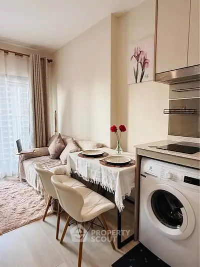Charming modern living room with cozy dining area and washing machine, perfect for urban living.