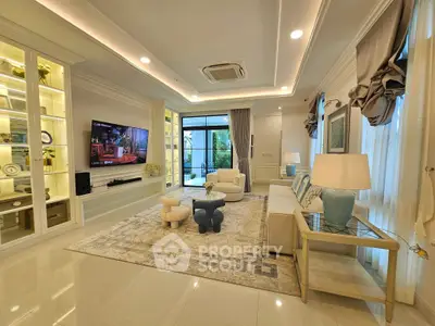 Luxurious living room with elegant decor and large windows overlooking garden