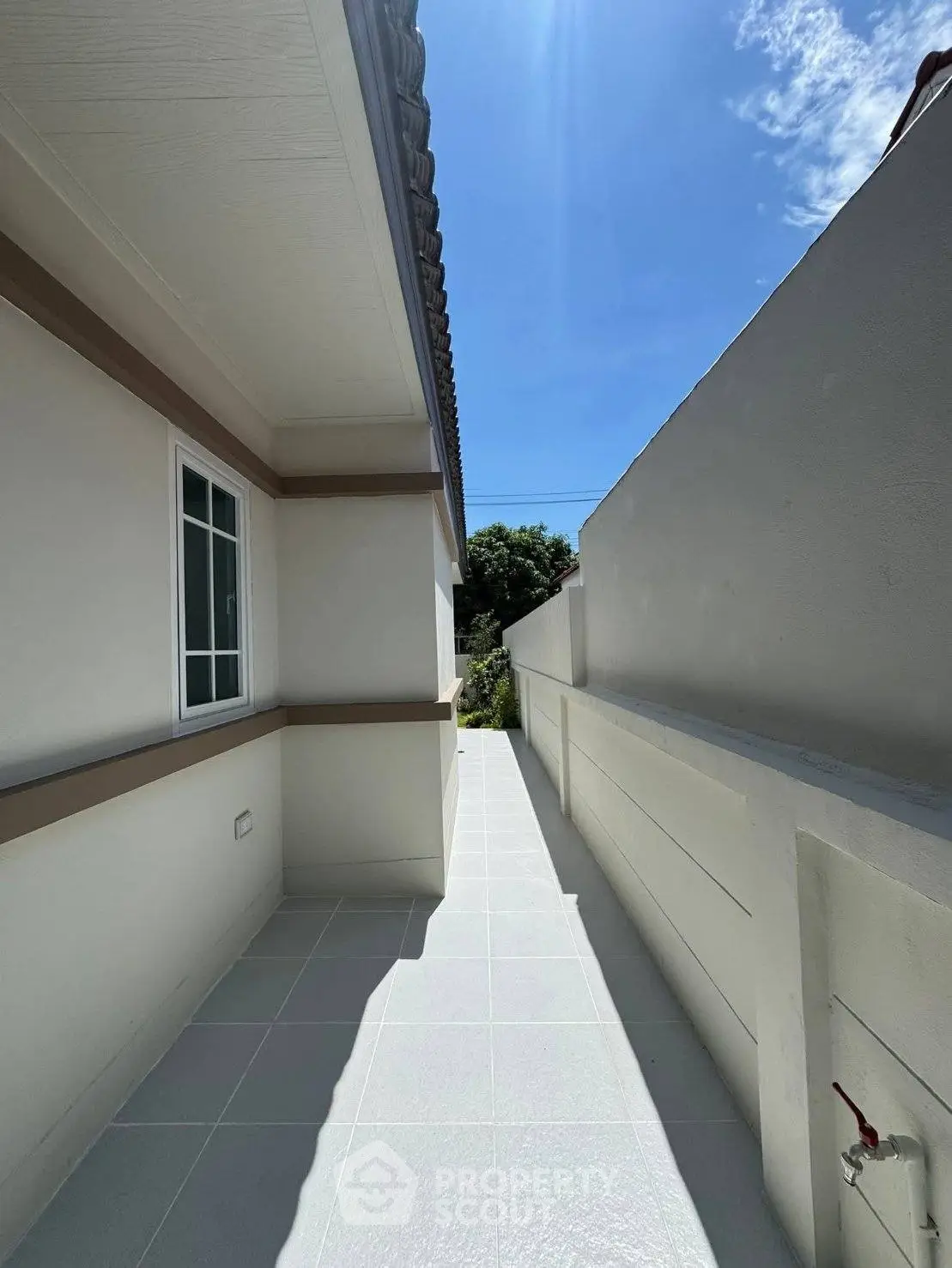 Modern exterior walkway with clean lines and bright natural lighting