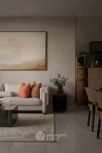 Elegant living room with modern decor, featuring a cozy sofa, stylish coffee table, and tasteful artwork.