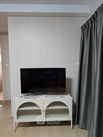Modern living room with stylish TV stand and elegant curtains