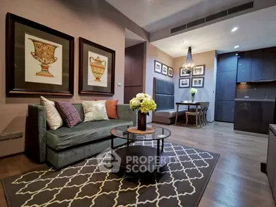 Stylish living room with elegant decor and modern kitchen in open layout apartment.