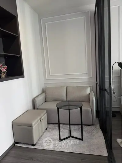 Cozy modern living room with stylish sofa and glass table