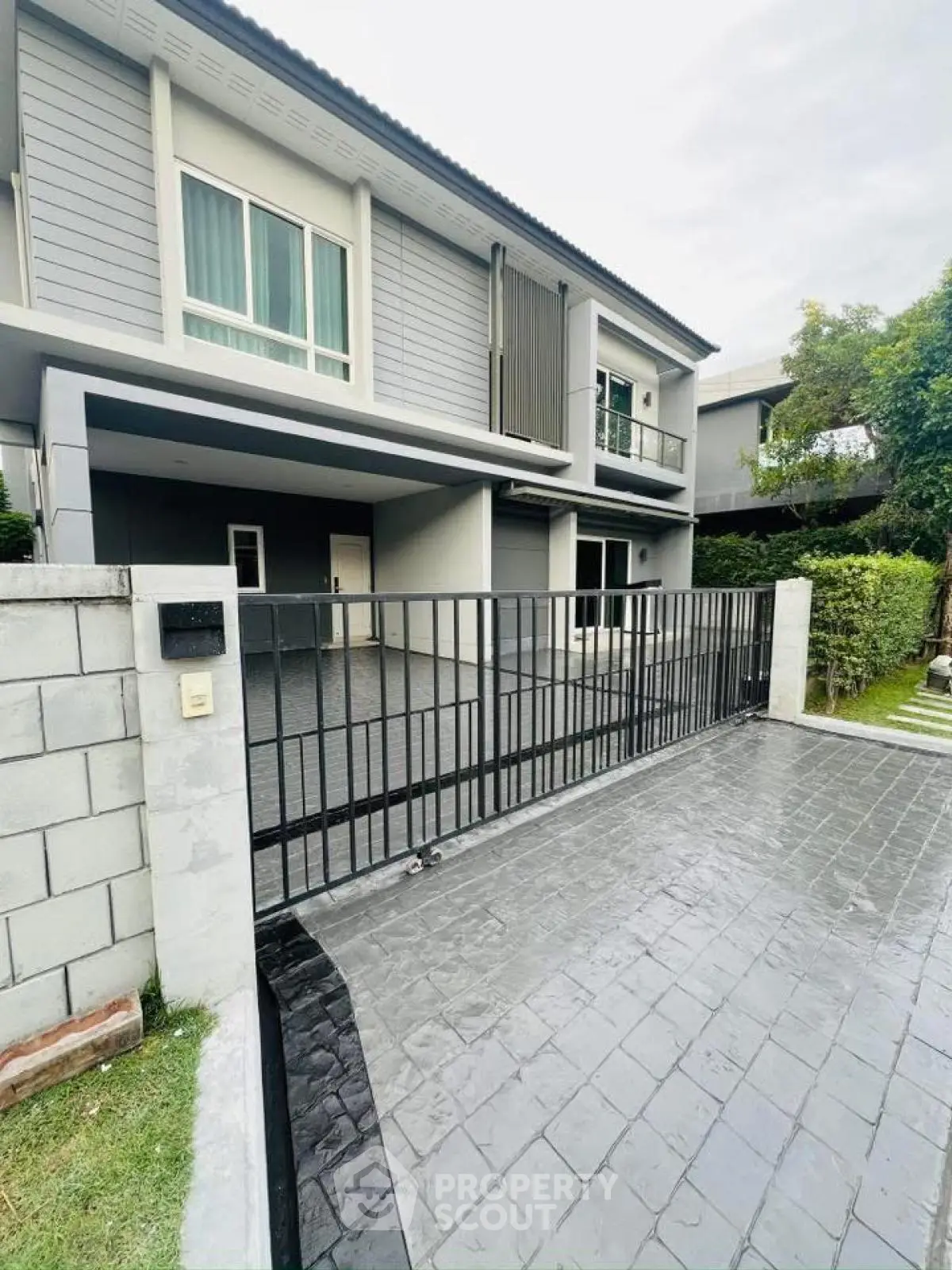 Modern two-story house with sleek design and spacious driveway