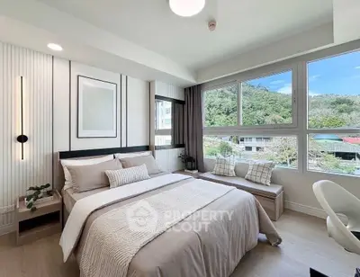 Bright and cozy bedroom with large windows offering scenic views, modern decor, and comfortable furnishings.