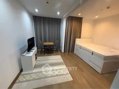 Modern studio apartment with cozy bed and stylish decor