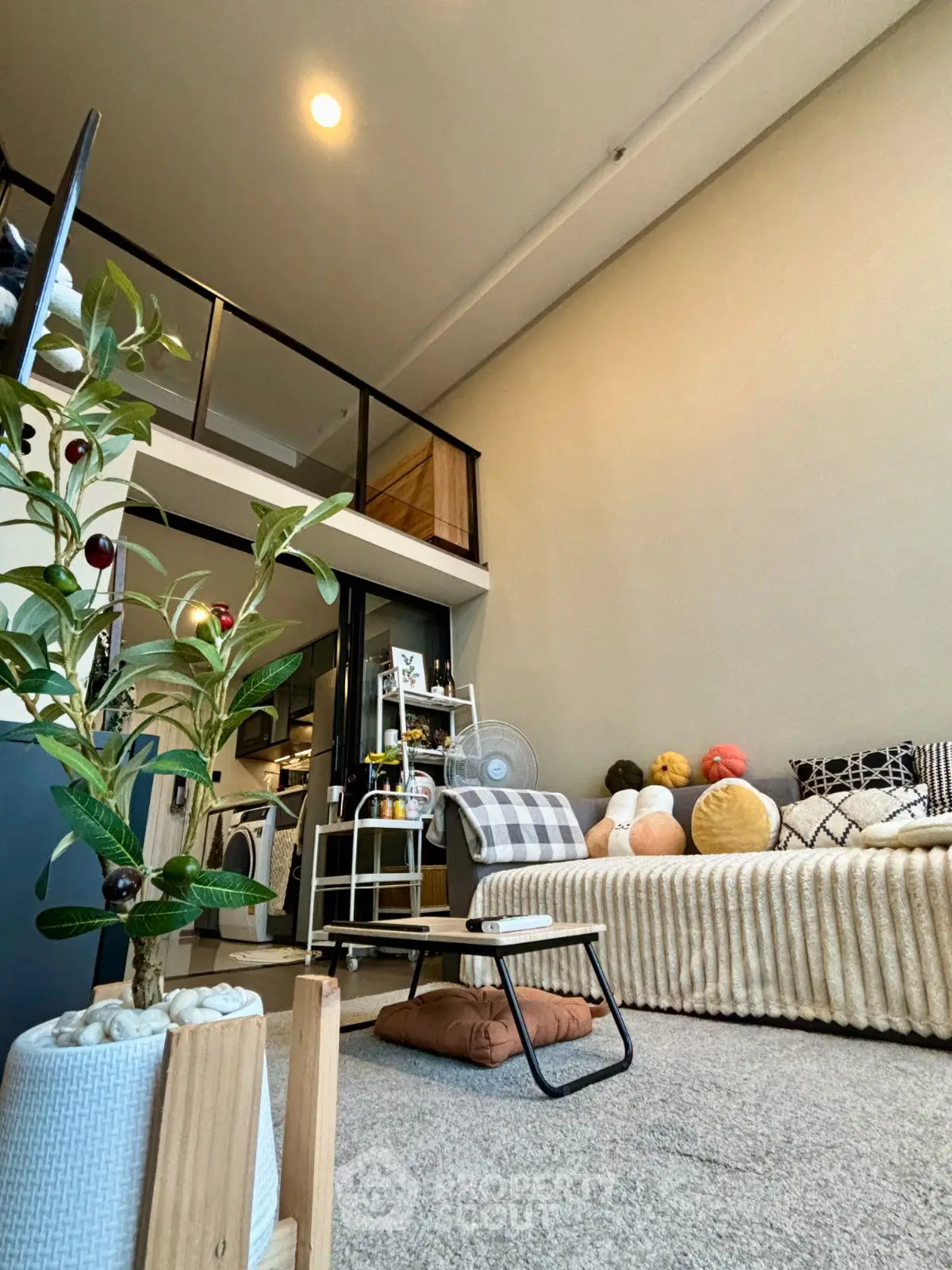 Stylish loft living room with modern decor and cozy seating area.