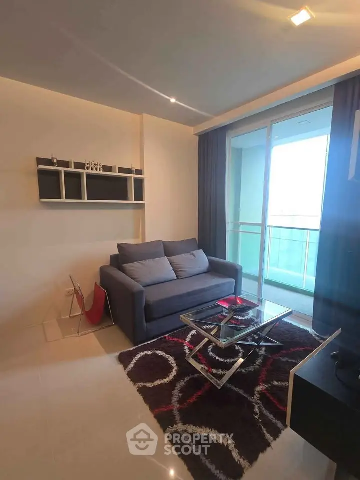 Modern living room with balcony access and stylish decor