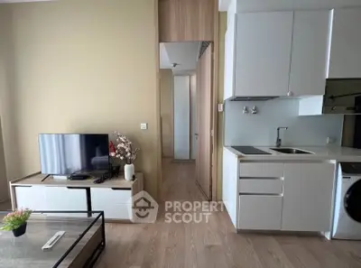 Modern living room with open kitchen and sleek design