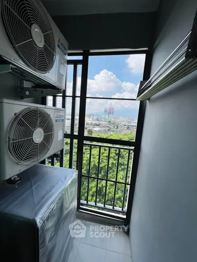 Compact balcony with air conditioning units and scenic city view