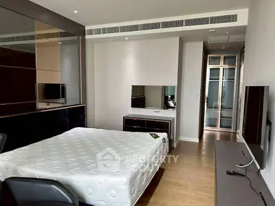 Modern bedroom with sleek design and ample natural light