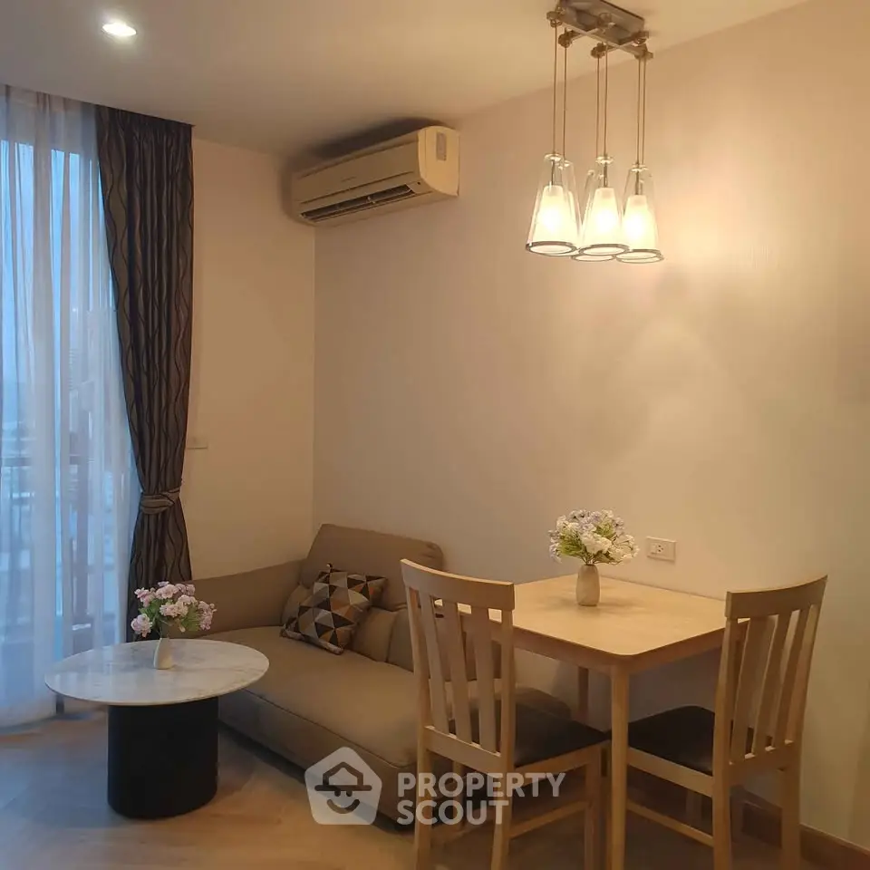 Cozy living room with modern furniture and elegant lighting in a stylish apartment.