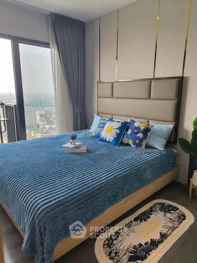 Modern bedroom with city view, featuring stylish decor and cozy bedding, perfect for urban living.