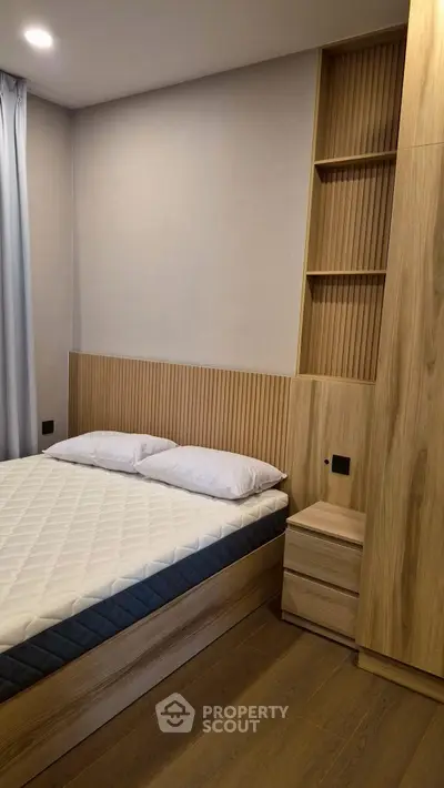 Modern bedroom with wooden accents and built-in storage