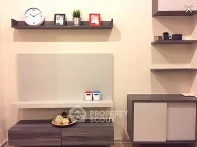 Modern living room with stylish shelves and decor accents