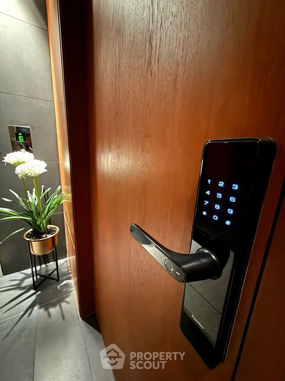 Modern apartment entrance with digital lock and elegant decor