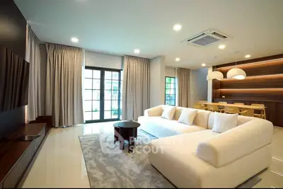 Spacious modern living room with elegant decor and ample natural light
