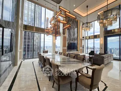 Luxurious high-rise living room with panoramic city views and elegant modern decor.