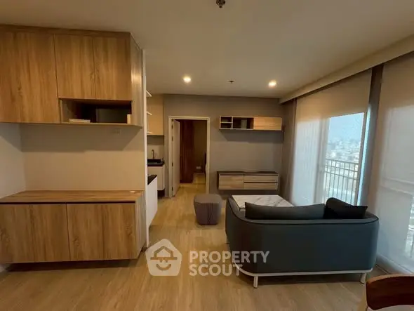 Modern living room with stylish furniture and city view balcony