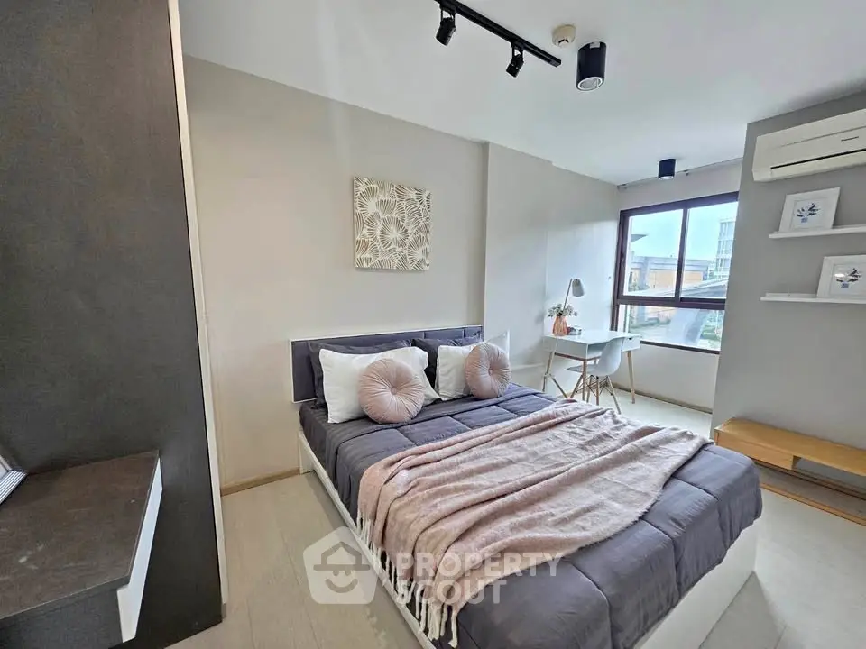 Modern bedroom with stylish decor and natural light