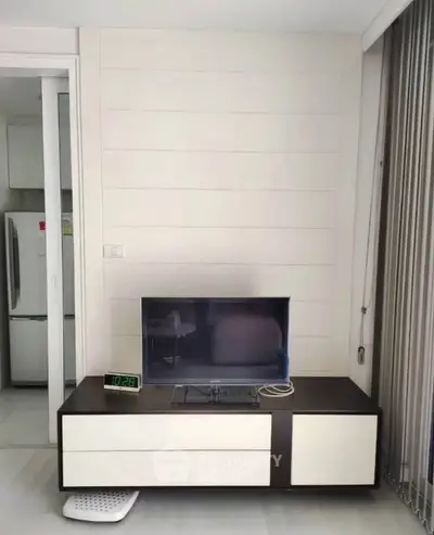 Modern living room with sleek TV stand and minimalist decor