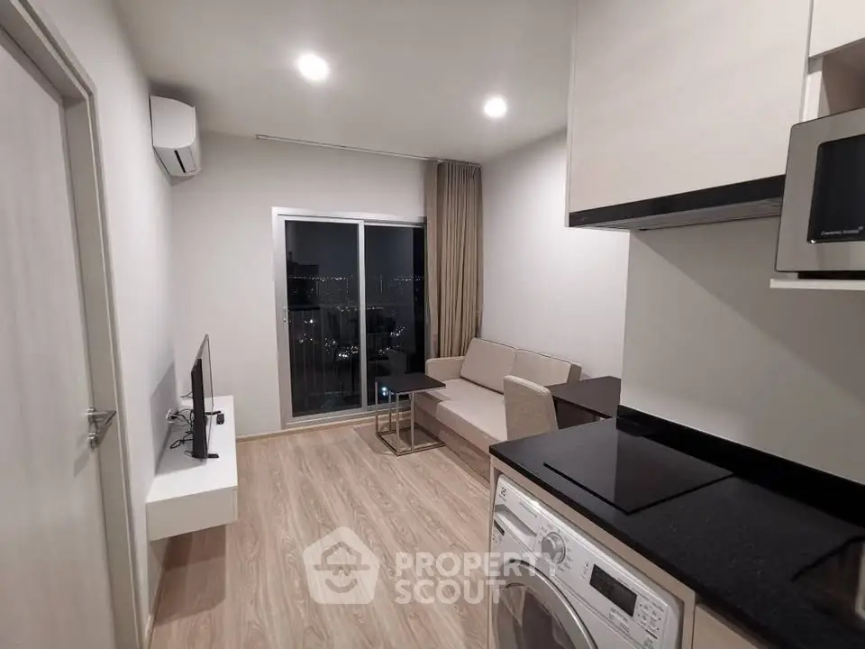 Modern apartment living room with open kitchen and city view